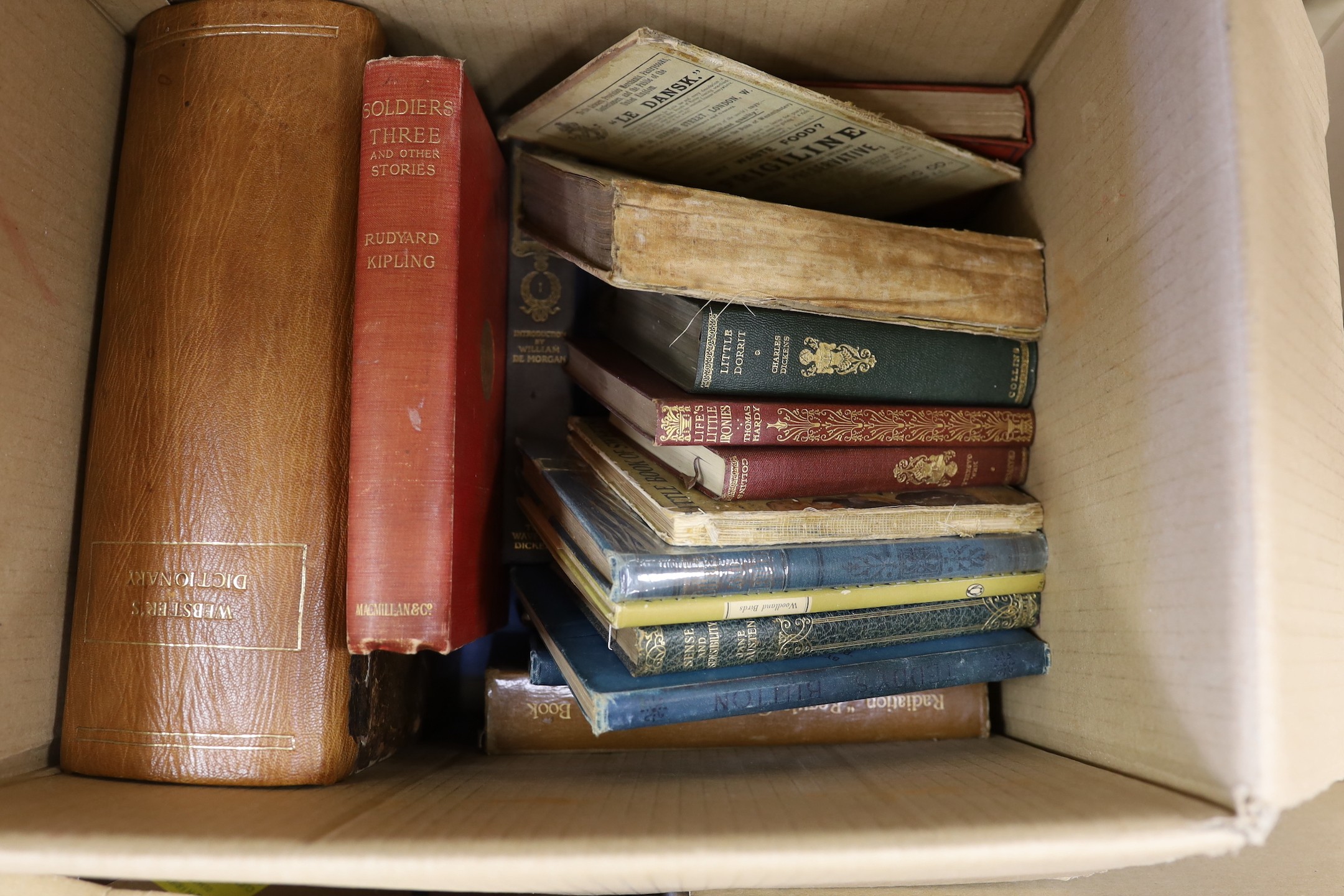 A quantity of assorted books to include Websters dictionaries.